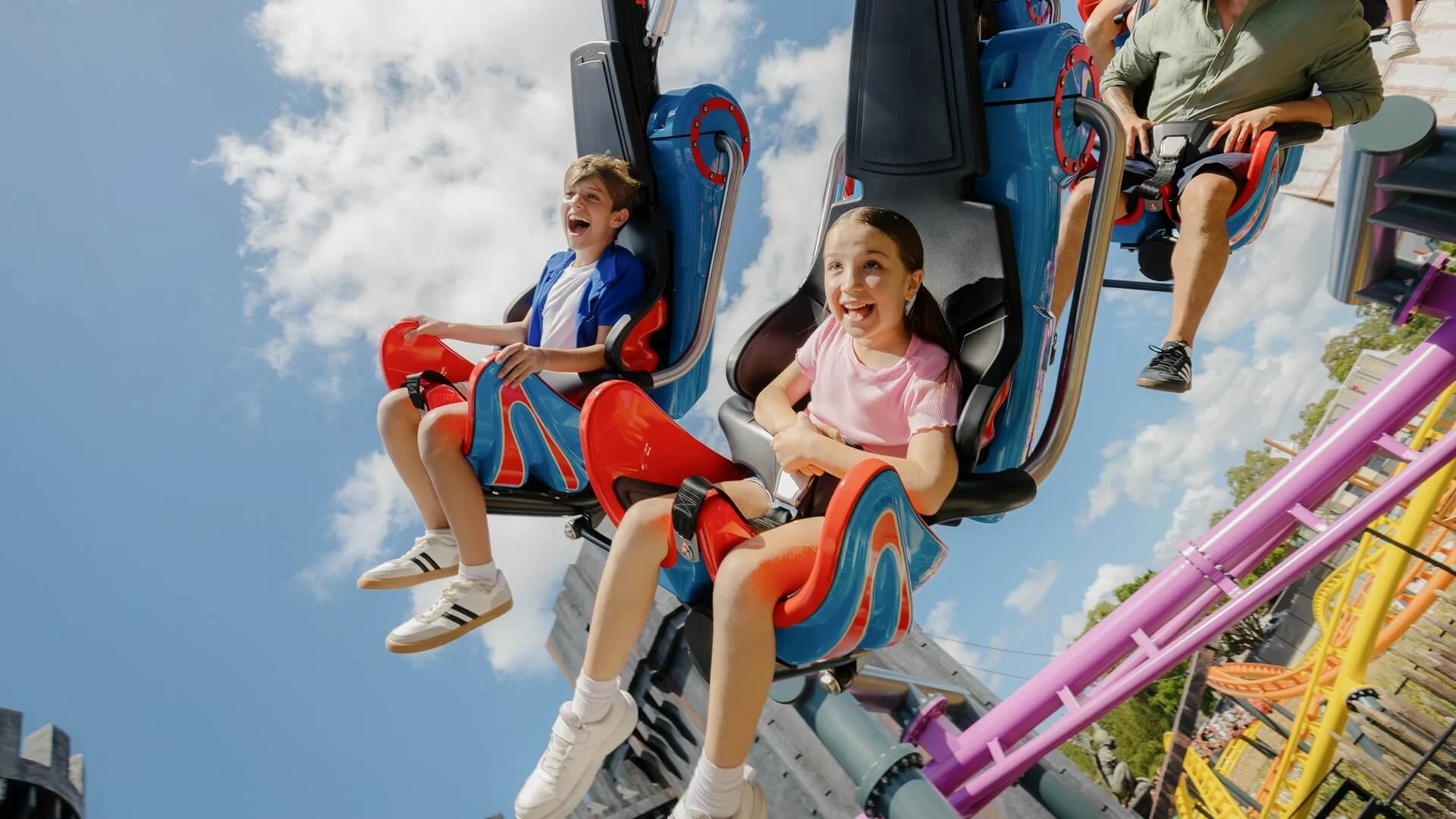 Riders on the Flight of the Wicked Witch coaster at Movie World